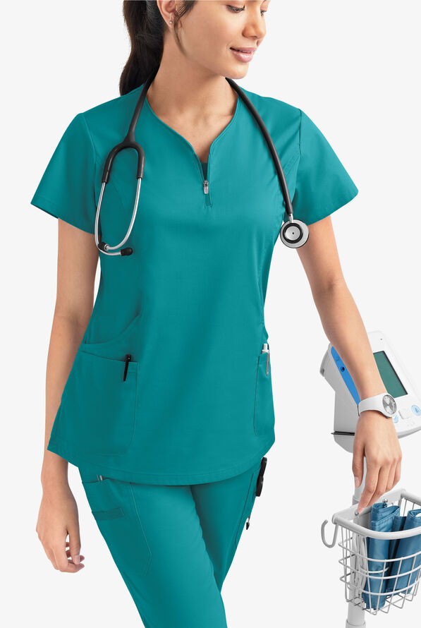 Blusa m&eacute;dica UA Butter-Soft STRETCH con cremallera en el cuello curvo y 4 bolsillos para mujer - Teal - 6