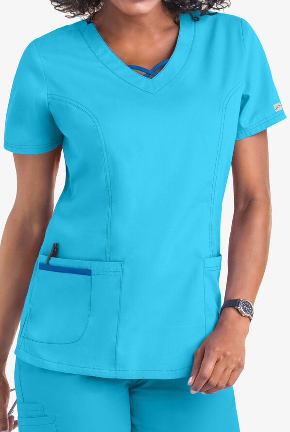Blusa médica Butter-Soft Core by UA™ con detalle entrecruzado en constraste en el cuello en V y 3 bolsillos para mujer - Turquoise/Royal - 2
