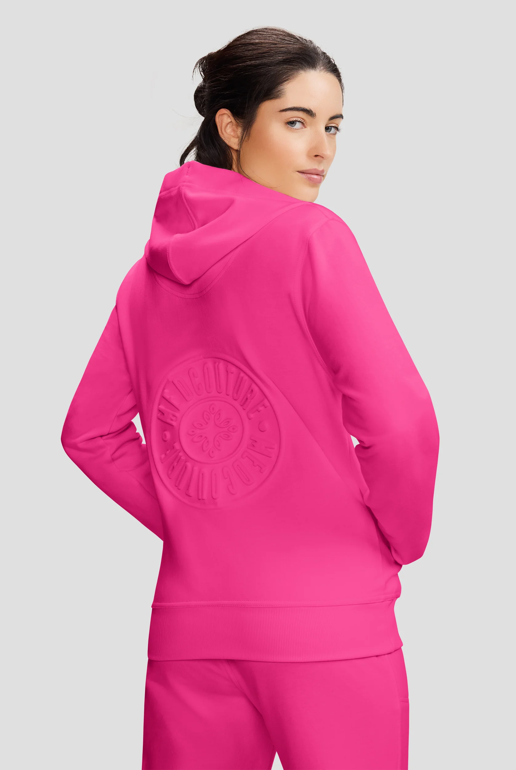 Med Couture Amp Women's 2-Pocket STRETCH Knit Embossed Logo Zip Hoodie Scrub Jacket